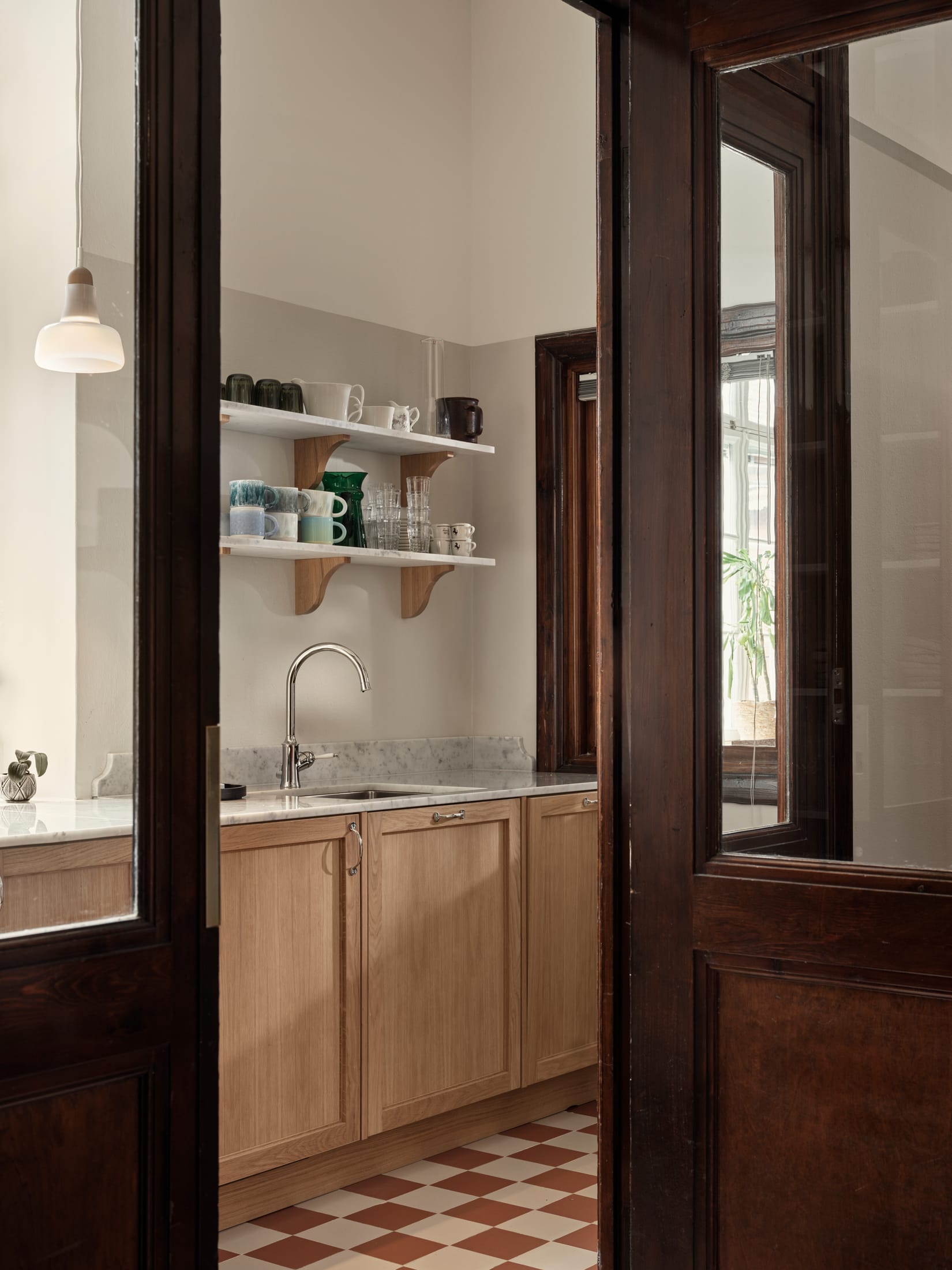 Modern loft structure integrated into a historic industrial interior without damaging the original walls.