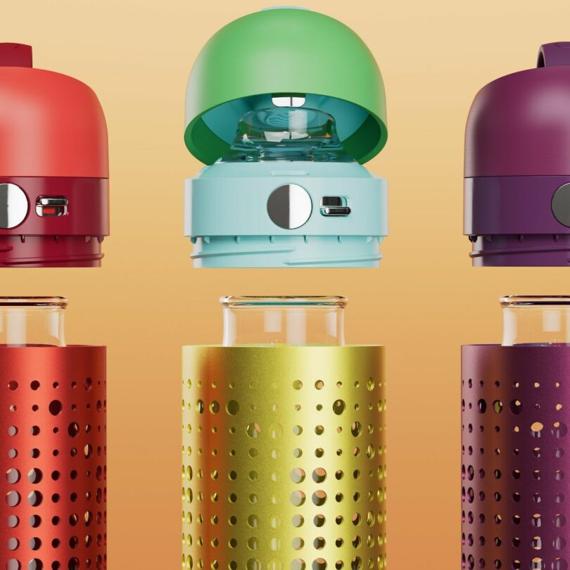 Three OKAPA glass bottles with perforated silicone sleeves in red, yellow, and purple against a beige background.