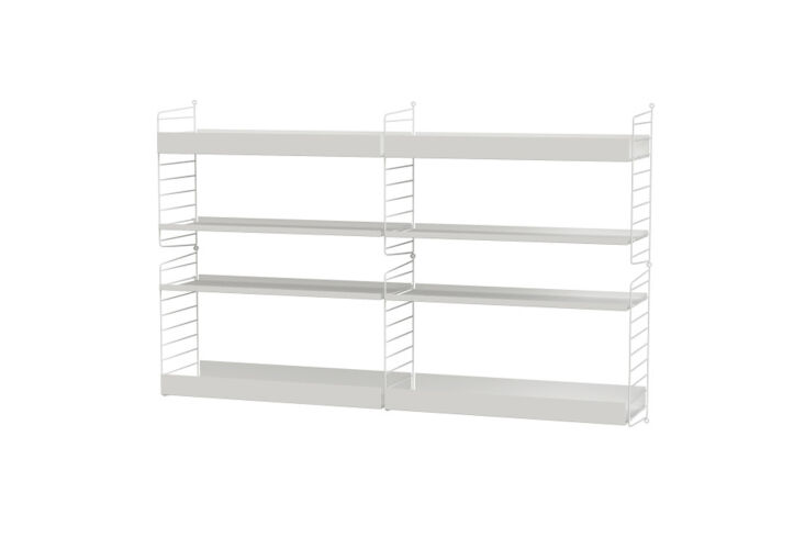 String Furniture modular shelving system in white with various shelf heights.