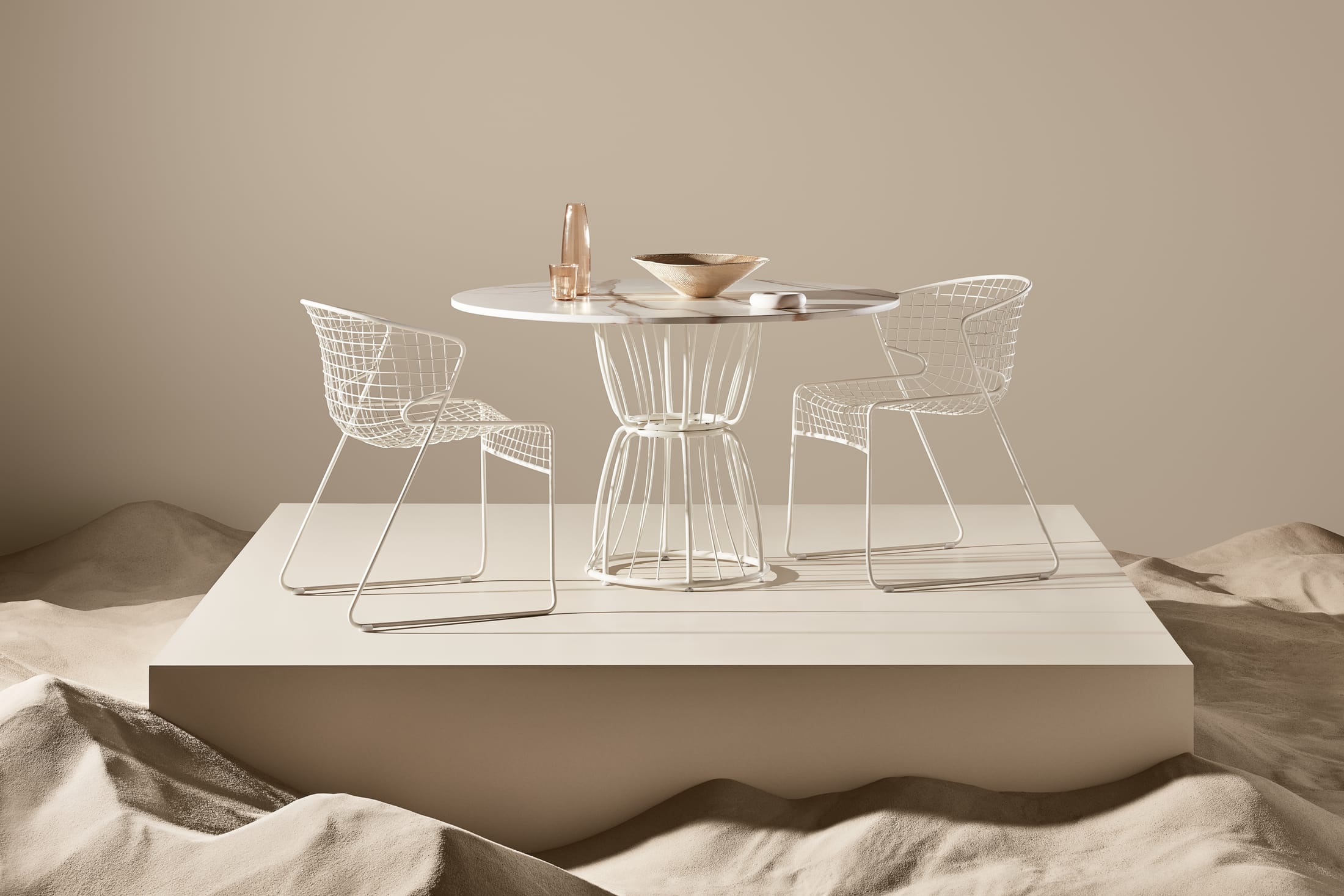 A modern designer table with a complex geometric lattice base and a circular top.