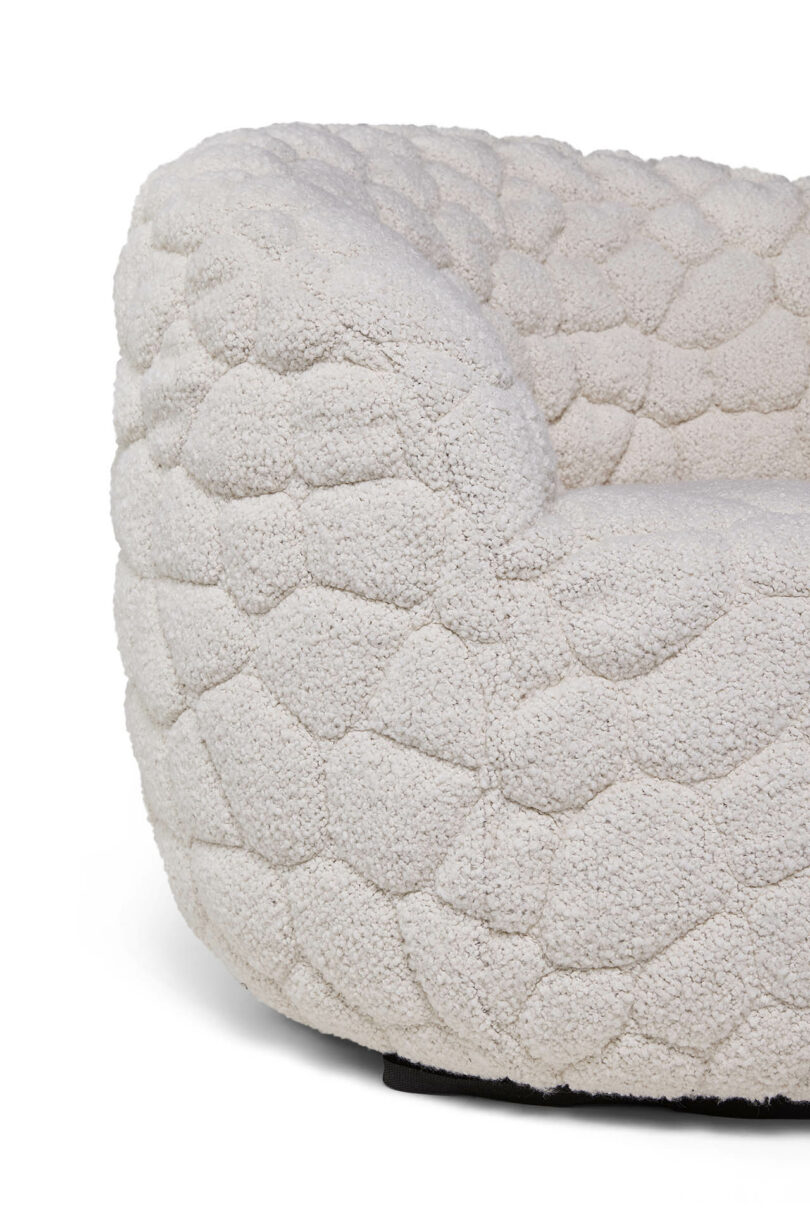 Extreme close-up of the hexagonal, textured 3D-quilted fabric of the Introvert Chair.