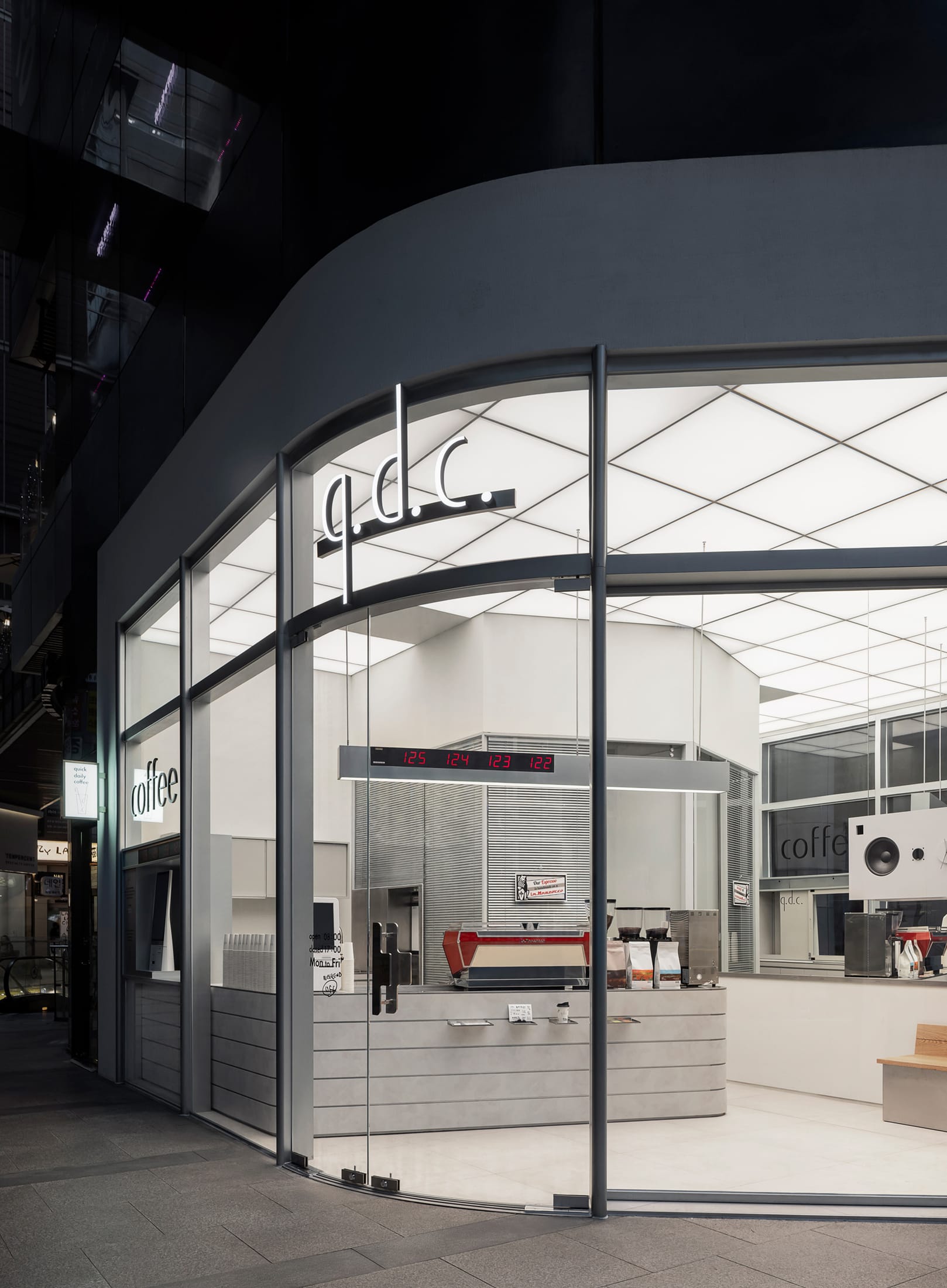 Detail shot of custom cabinet handles shaped like oversized paper clips.