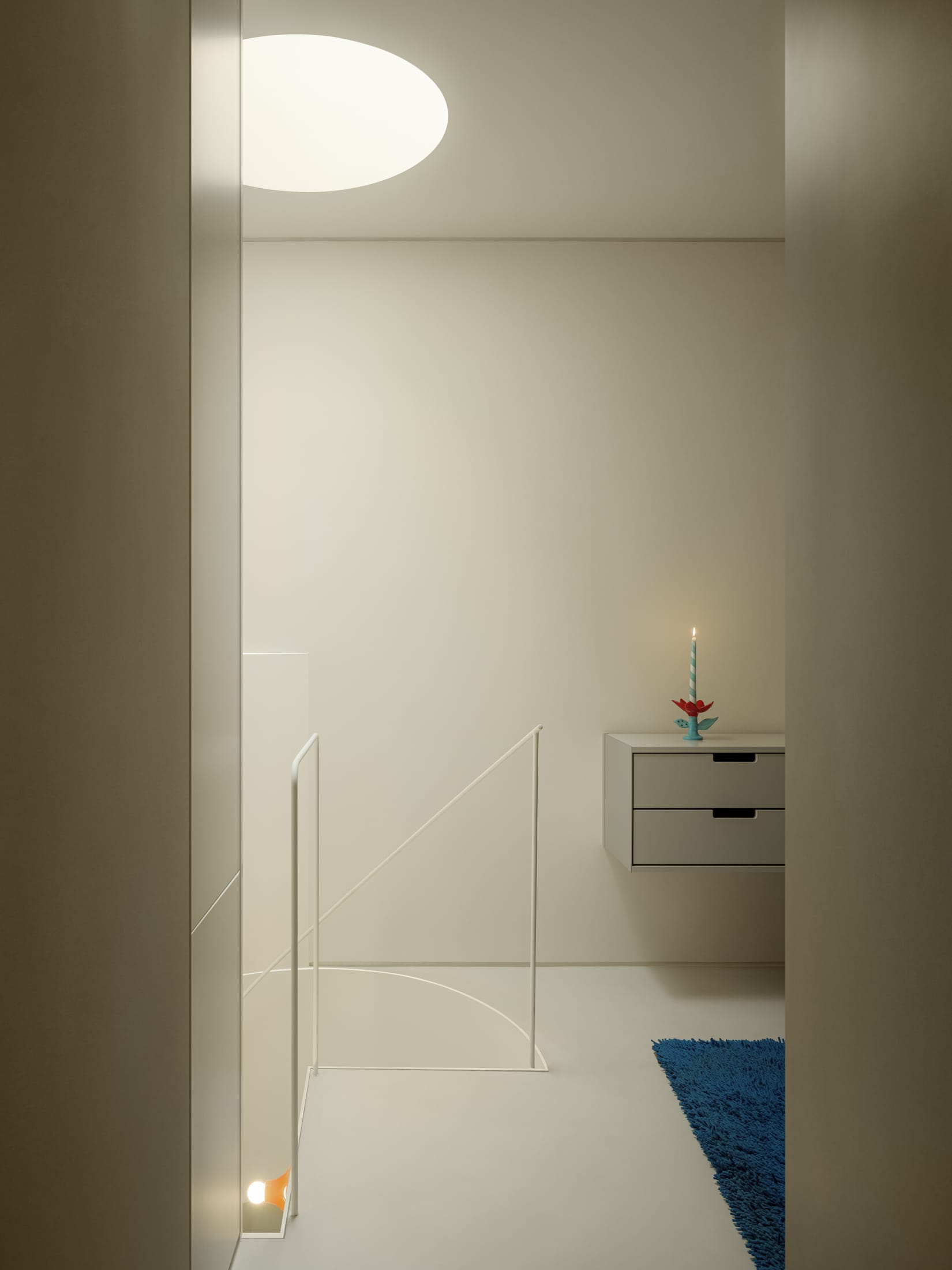 Soft natural sunlight casting geometric shadows across a minimalist interior corridor.