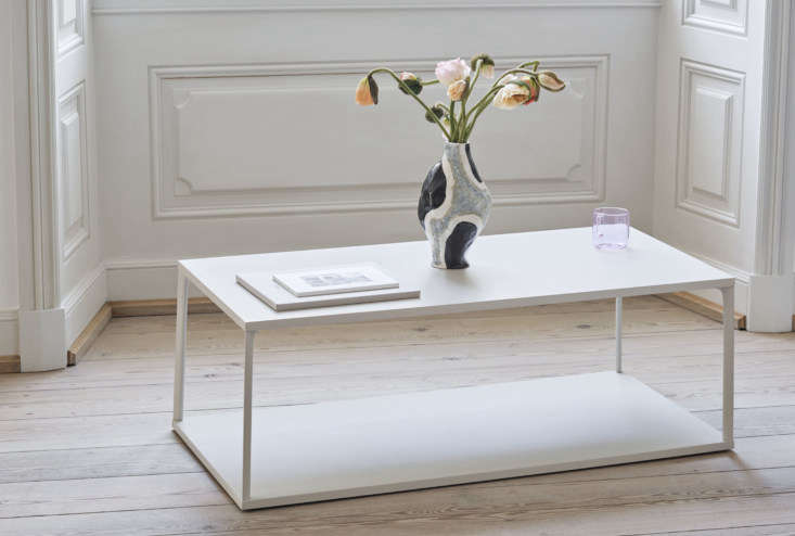 A white rectangular coffee table with a modern minimalist frame.