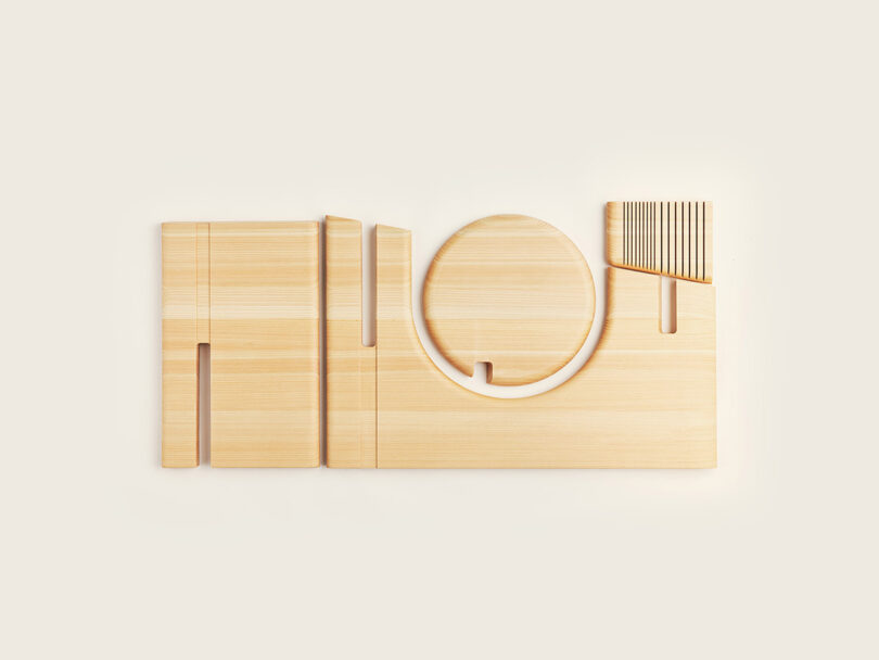 Deconstructed wooden components of the Bookmarker table showing precision-cut slots and geometric shapes.