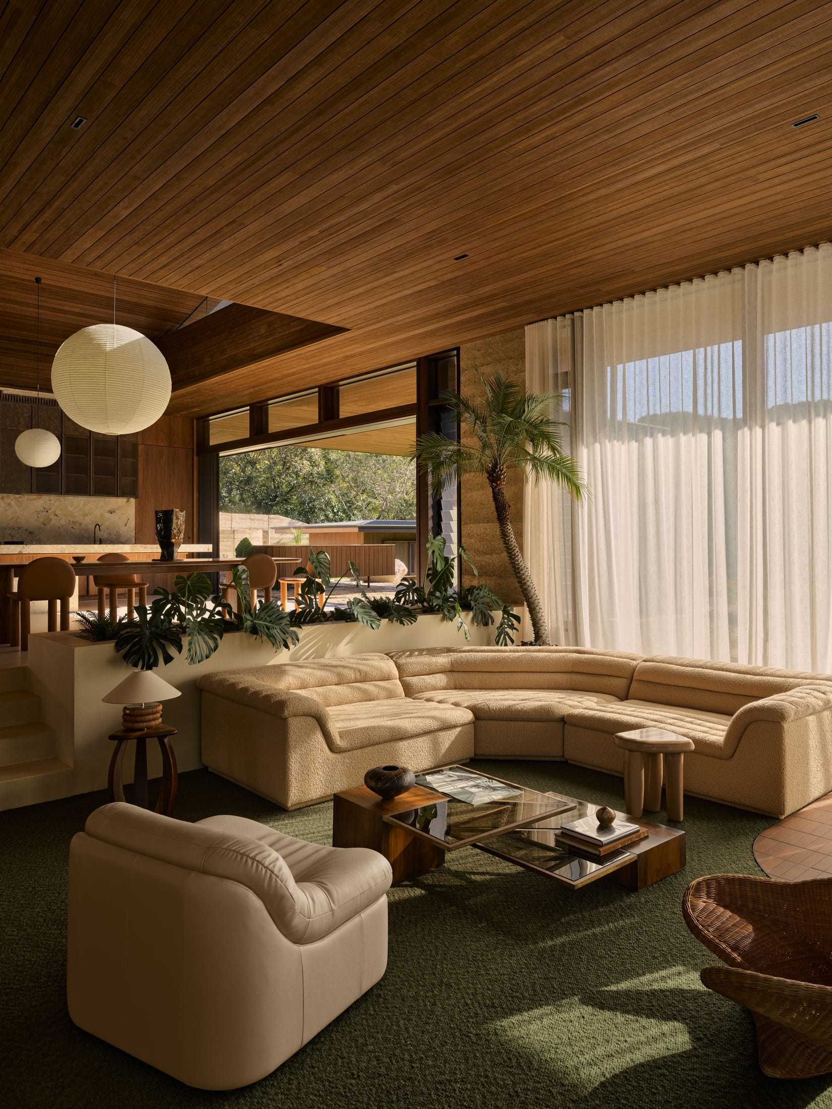 Modern living room featuring a sunken lounge and Ellison Studios furniture.