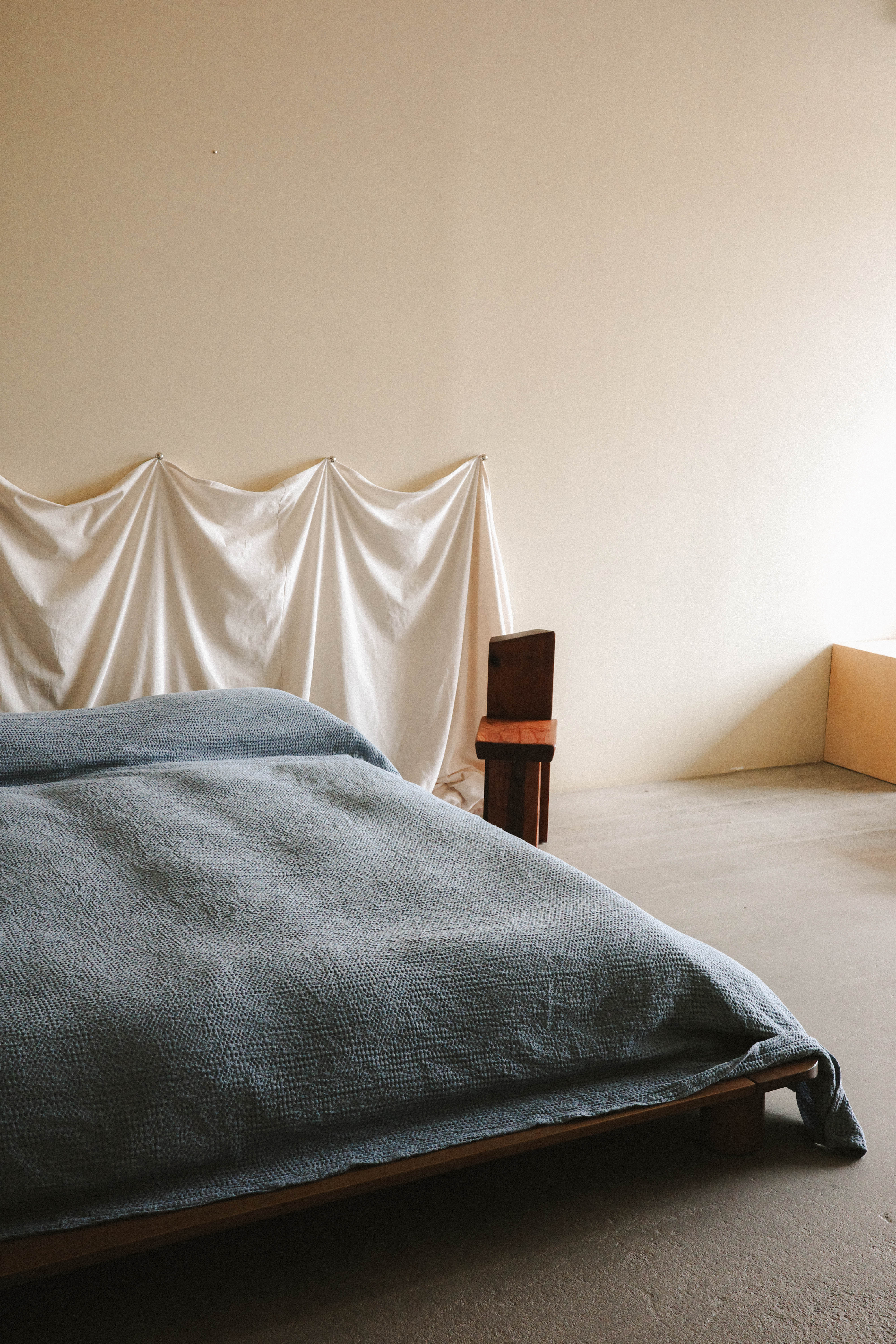 Graphic text overlay reading 'DIY: A Simple, Fresh Headboard Hack'.