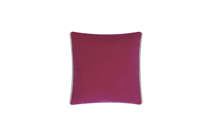 A decorative pillow featuring a vibrant Magenta Blossom floral pattern.