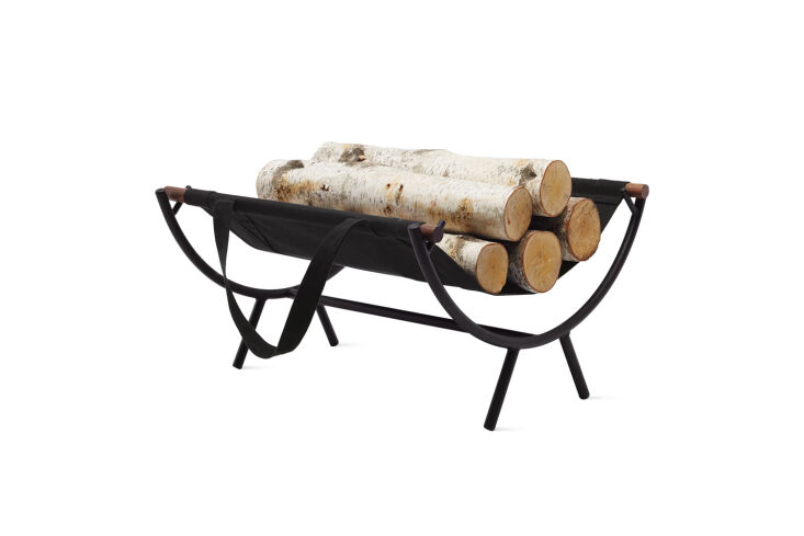 Mid-century modern Nelson Fireplace Caddy with walnut dowels and a black canvas sling.