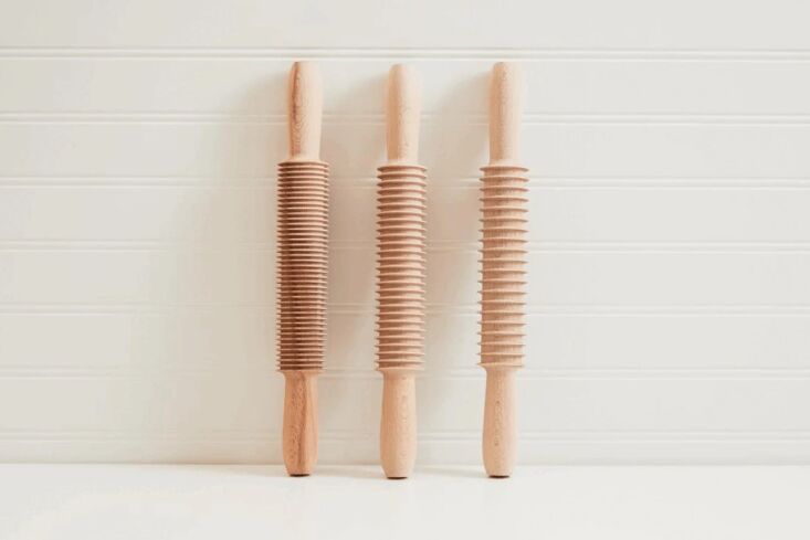 Three Italian beechwood cutting rolling pins for making spaghetti, fettuccine, and pappardelle.