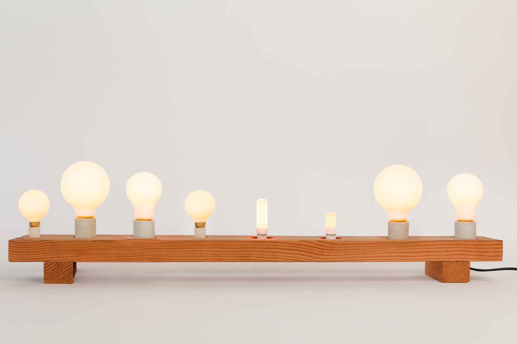 A lineup of various Ravenhill Studio DTW LED bulbs in different sizes and shapes.