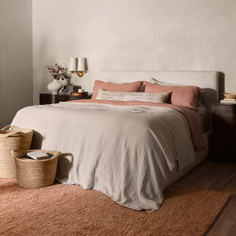 A hand-knotted area rug from The Citizenry featuring natural textures and fringe.