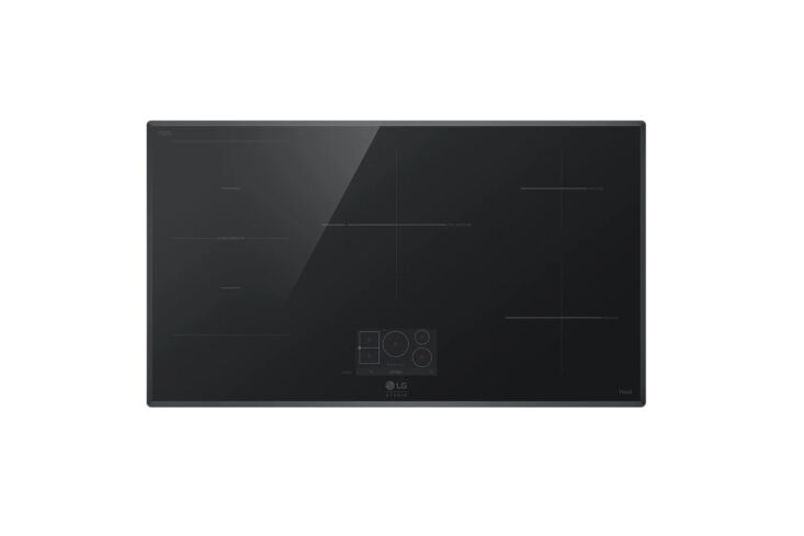 LG Studio induction cooktop with a minimalist black glass finish and digital interface.