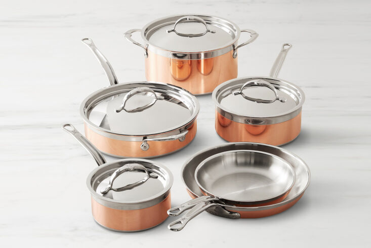Hestan Copperbond set featuring polished copper exteriors and induction-compatible stainless steel bases.