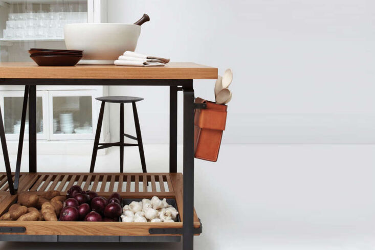 March Work Table in white oak with integrated storage boxes and wine rack.
