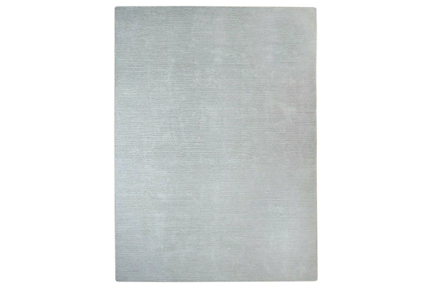 A neutral-toned Signature Solid Strie Wool Rug by Organic Weave.