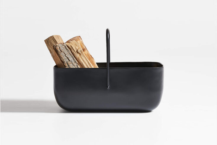 Industrial-style Telum Black Log Holder made of solid iron.