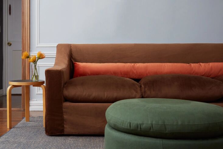 A velvet Sabai Evergreen Sofa in a modern interior.