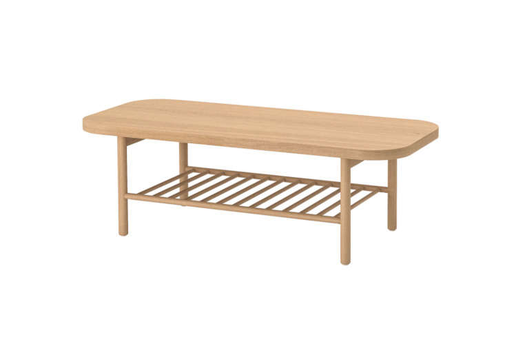 Oak veneer rectangular coffee table with rounded edges.