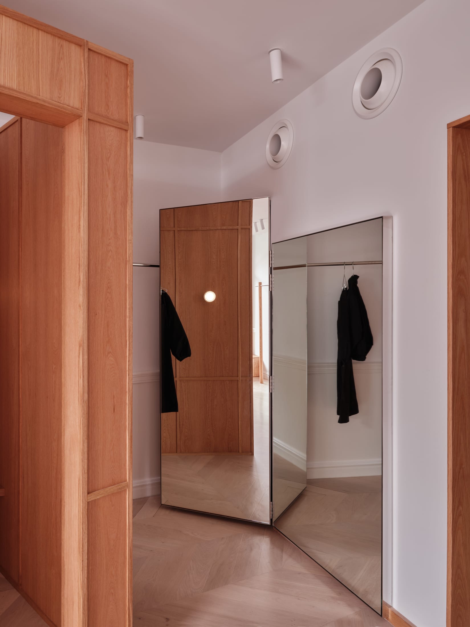 Soft draped silk curtains and minimalist shelving showcasing the Deiji collection.