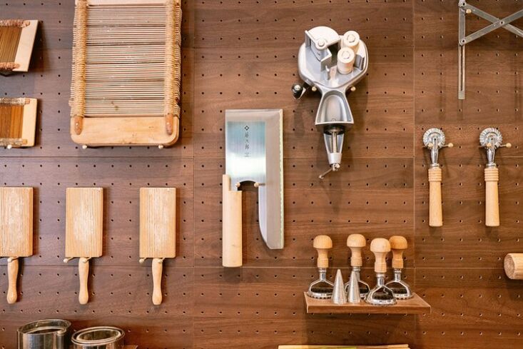 A rhythmic arrangement of various kitchen tools highlighting the beauty in repetition.