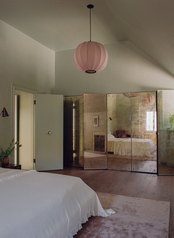 An original faux-foxed mirrored closet in a historic 1920s home.