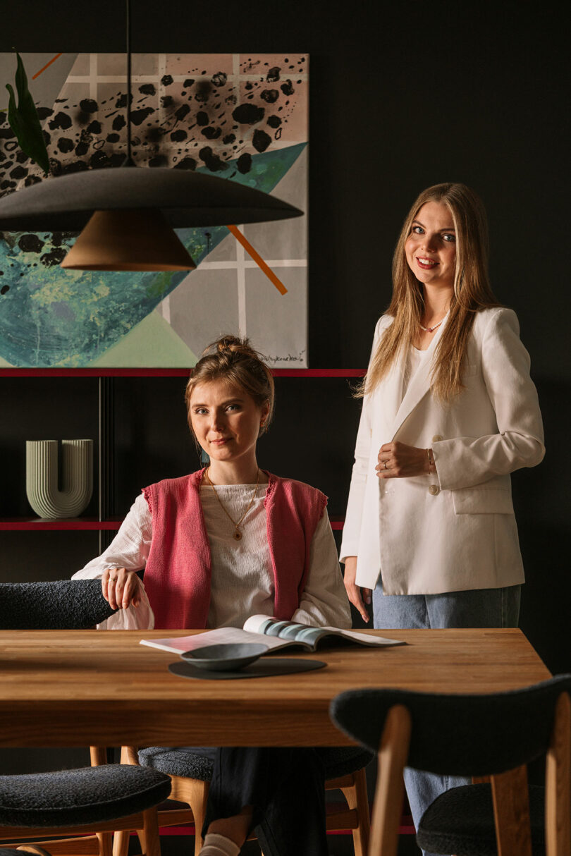 Designers Anna Baranowska and Joanna Felczuk of Butterfly Studio posing in the completed Kraków apartment.