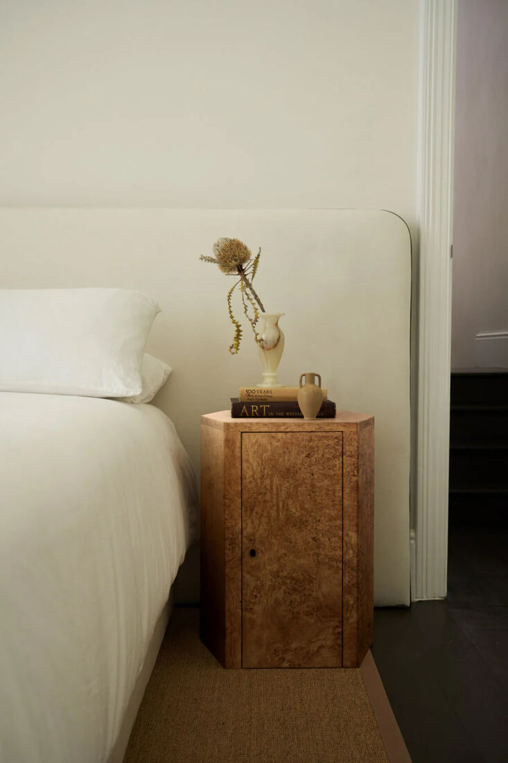 Claude Park Nightstand featuring poplar burl wood and a blackened brass handle.