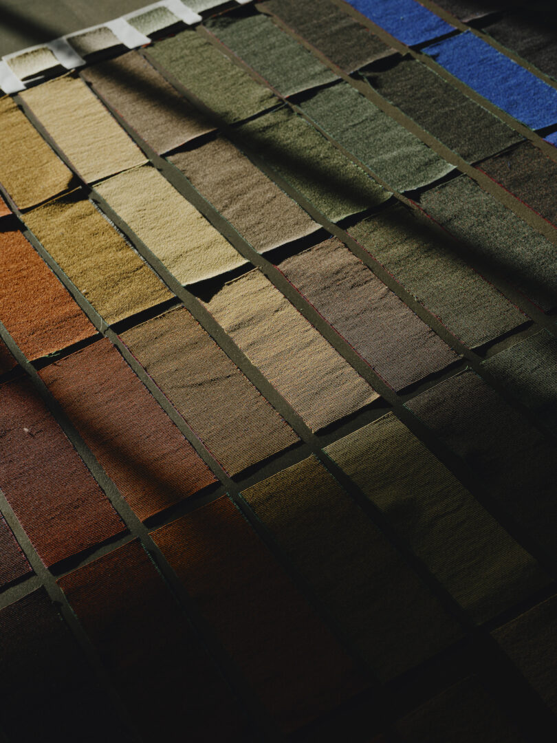 A grid of rectangular fabric swatches in various muted and earthy tones.