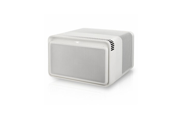 A Windmill AC unit installed in a window, featuring rounded edges and a minimalist white finish.