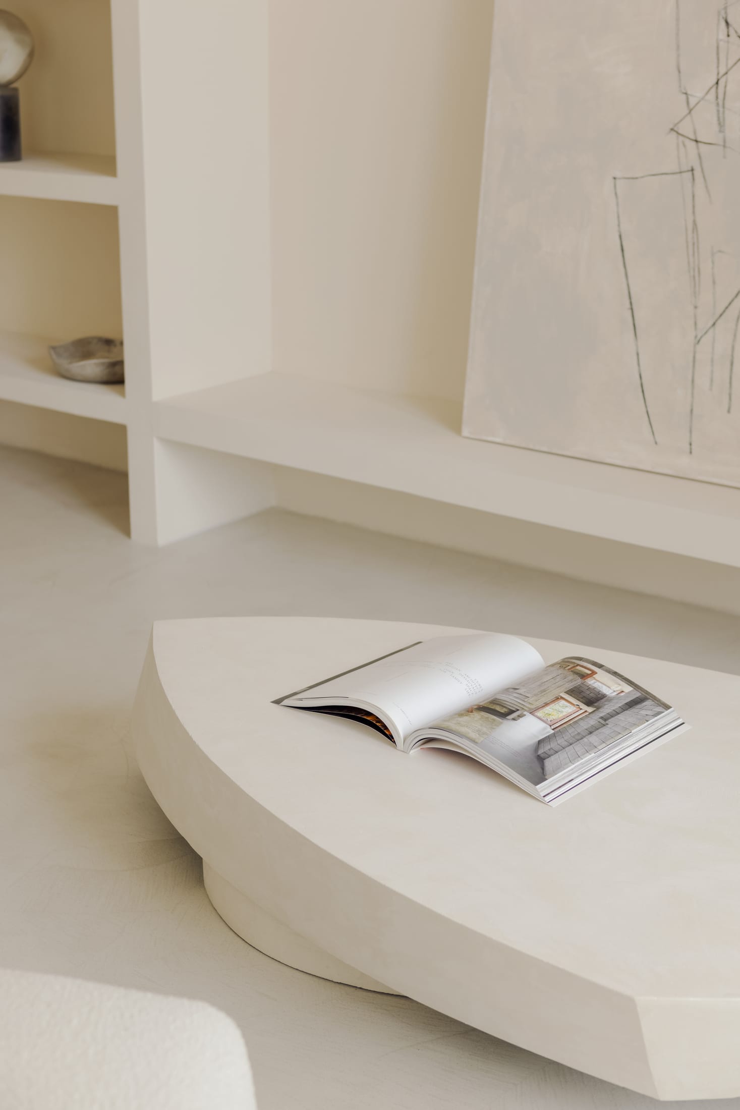 Close-up of a custom-designed travertine washbasin in the bathroom.