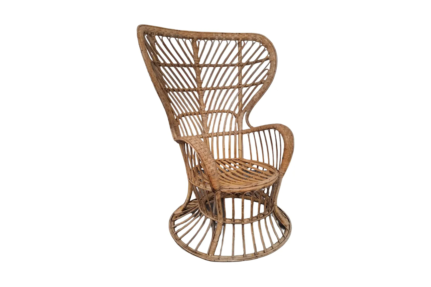 A vintage wicker chair in the corner of a neutrally painted bedroom.