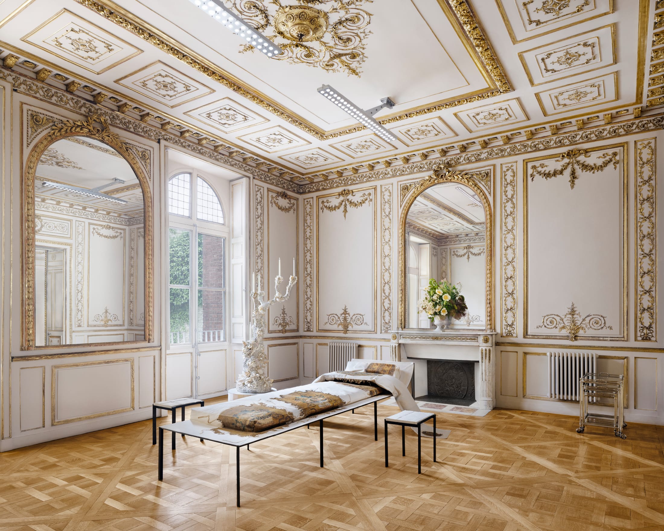 A large open-plan area within the Acne Studios Paris headquarters showing the tall ceilings and minimalist layout.