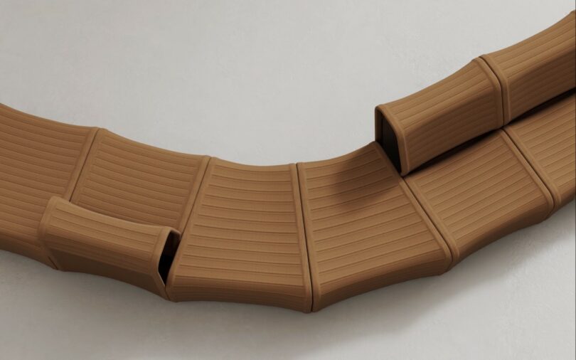 An alternating arrangement of modular brown Isomi Knit One seating units.