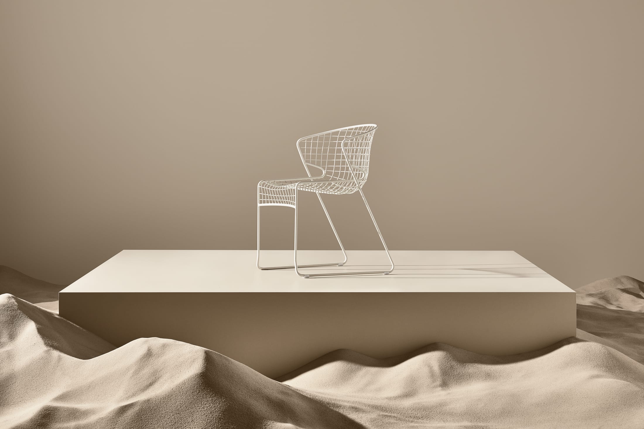 Multiple pieces of the Nautiloid collection arranged in a clean, minimalist interior space.