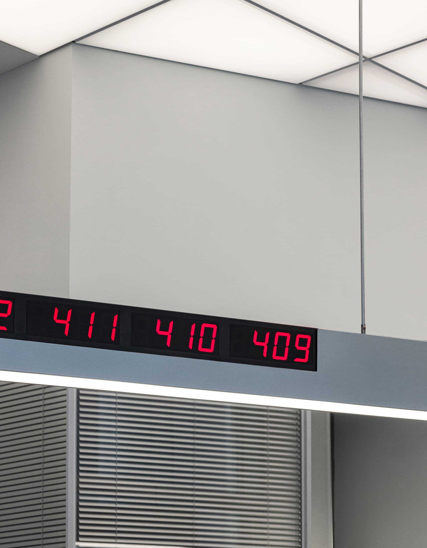 An interior perspective showing mirrored walls reflecting the cafe's lights and seating area.