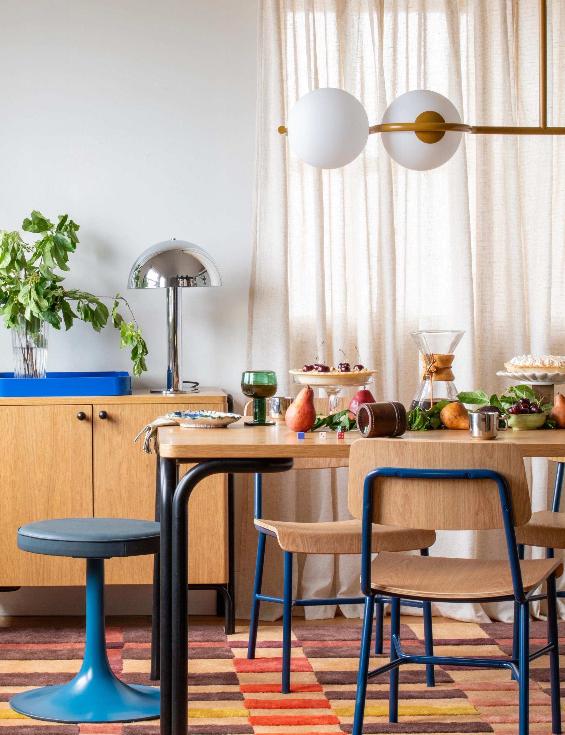 A contemporary table layout showing varied plates and modern minimalist decor.