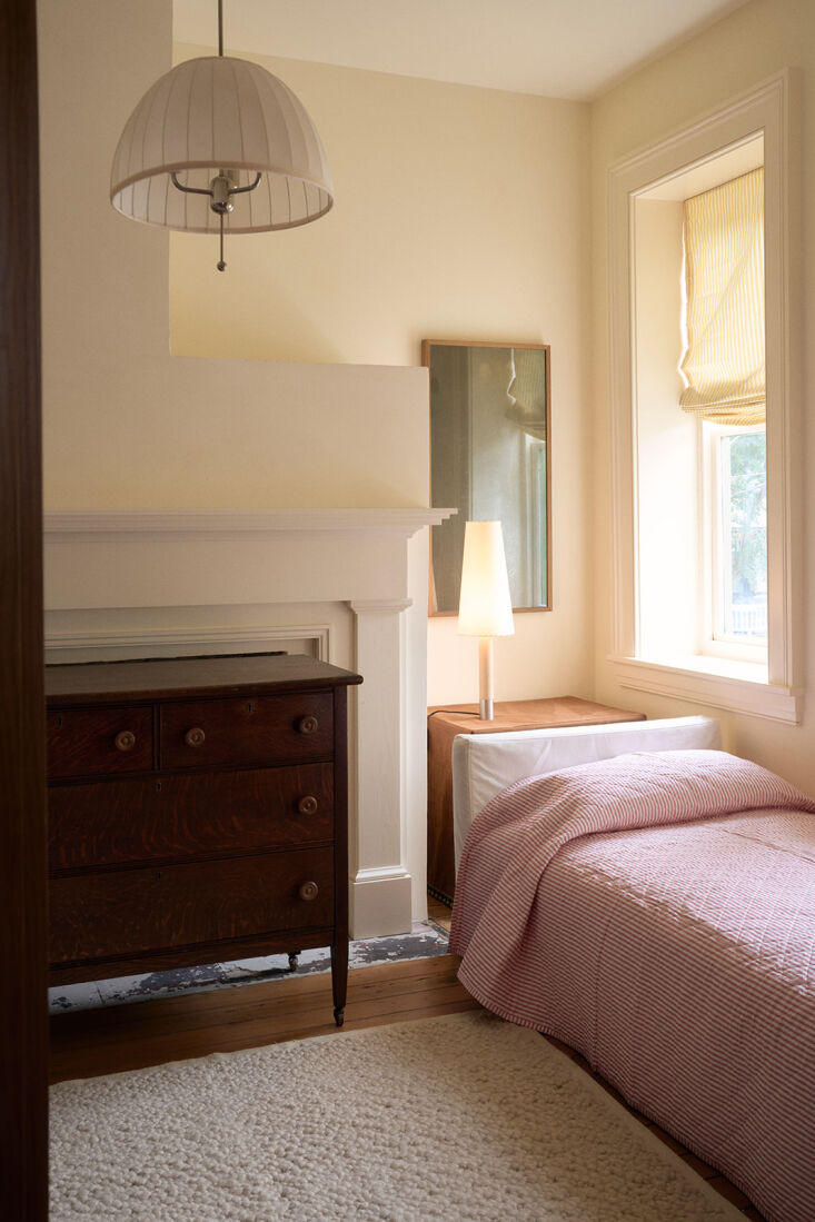 Santa & Cole lamp used as a bedside light in a thoughtfully restored townhouse.