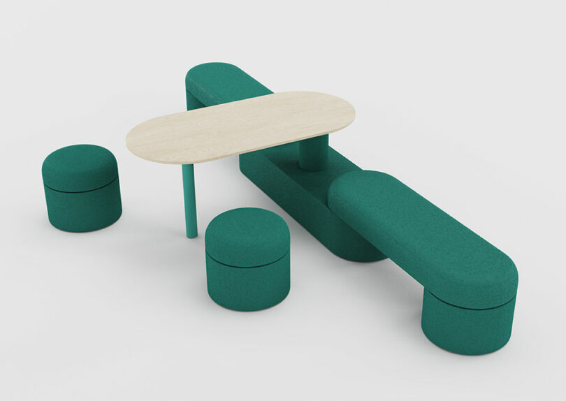 A green upholstered bench and stool arrangement with a light wood oval table.