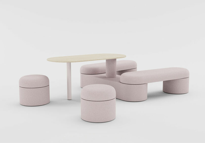 Light pink upholstered modular furniture set including stools, benches, and a table.