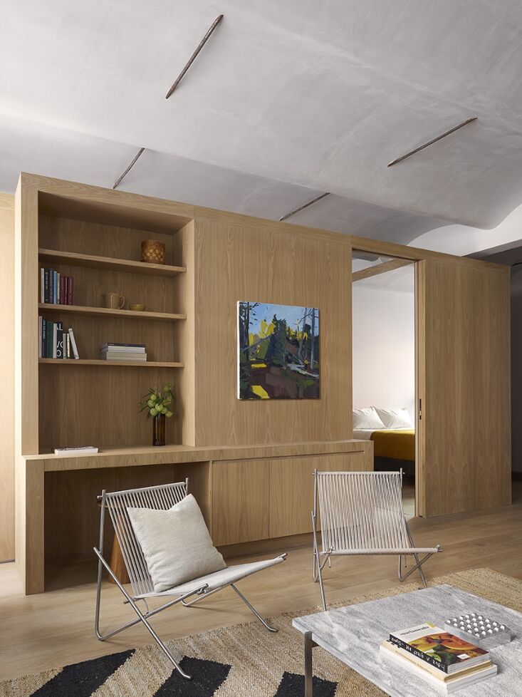 Minimalist interior featuring a PK4 chair and a Japanese-style Akari pendant light.