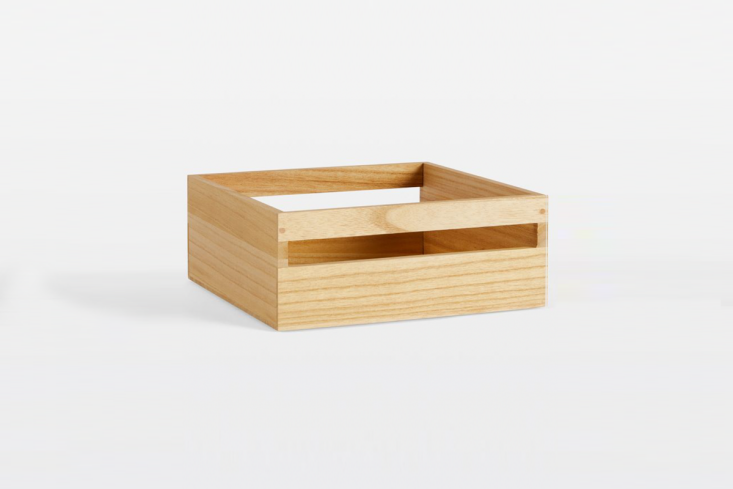 A simple wooden paulownia wood bin used for desk organization.