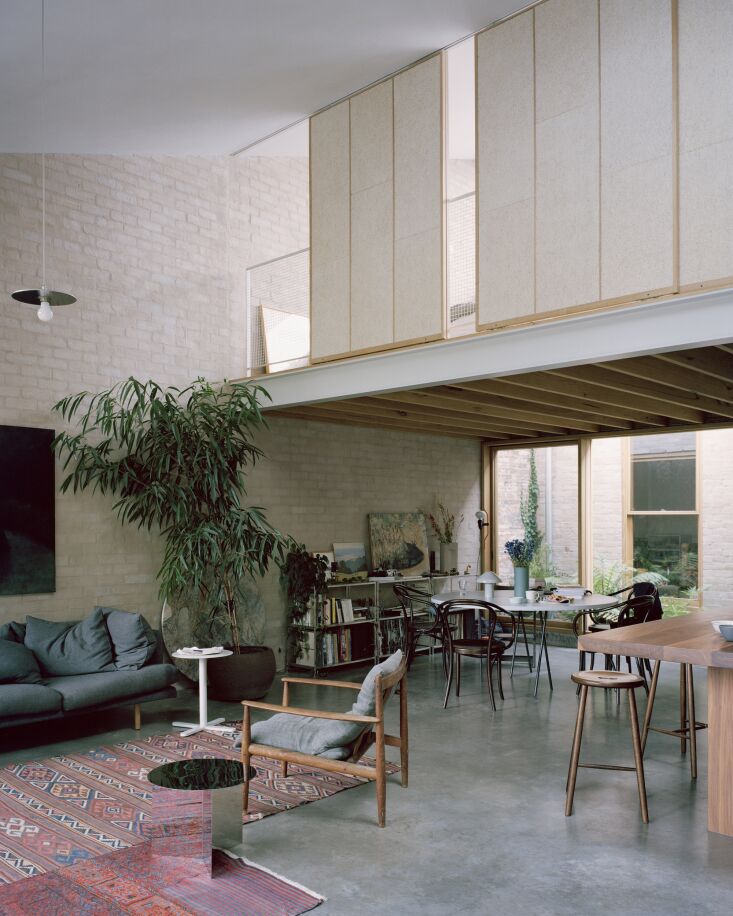 Close-up of sliding screens made from textured wood wool panels.