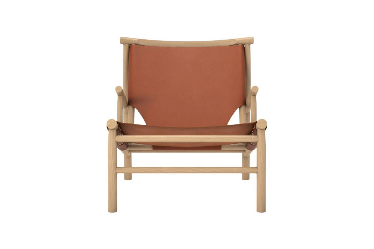 The Samurai Lounge Chair in oak and saddle leather, showcasing its sculptural back profile.