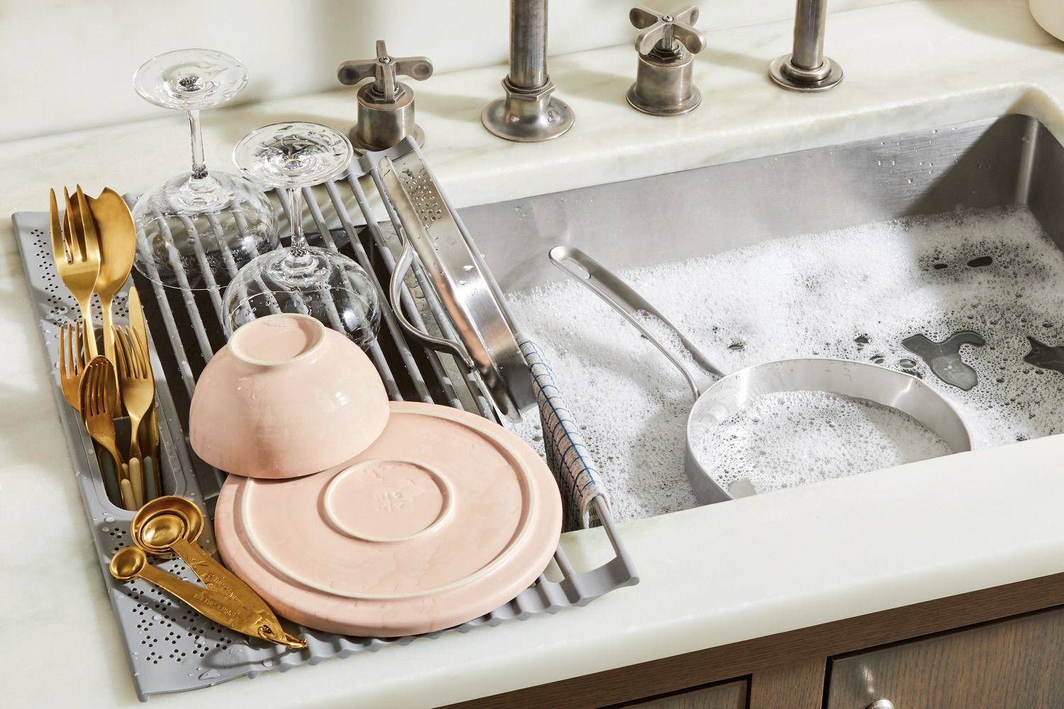 Graphic text overlaying a modern kitchen scene inviting community feedback for product design.