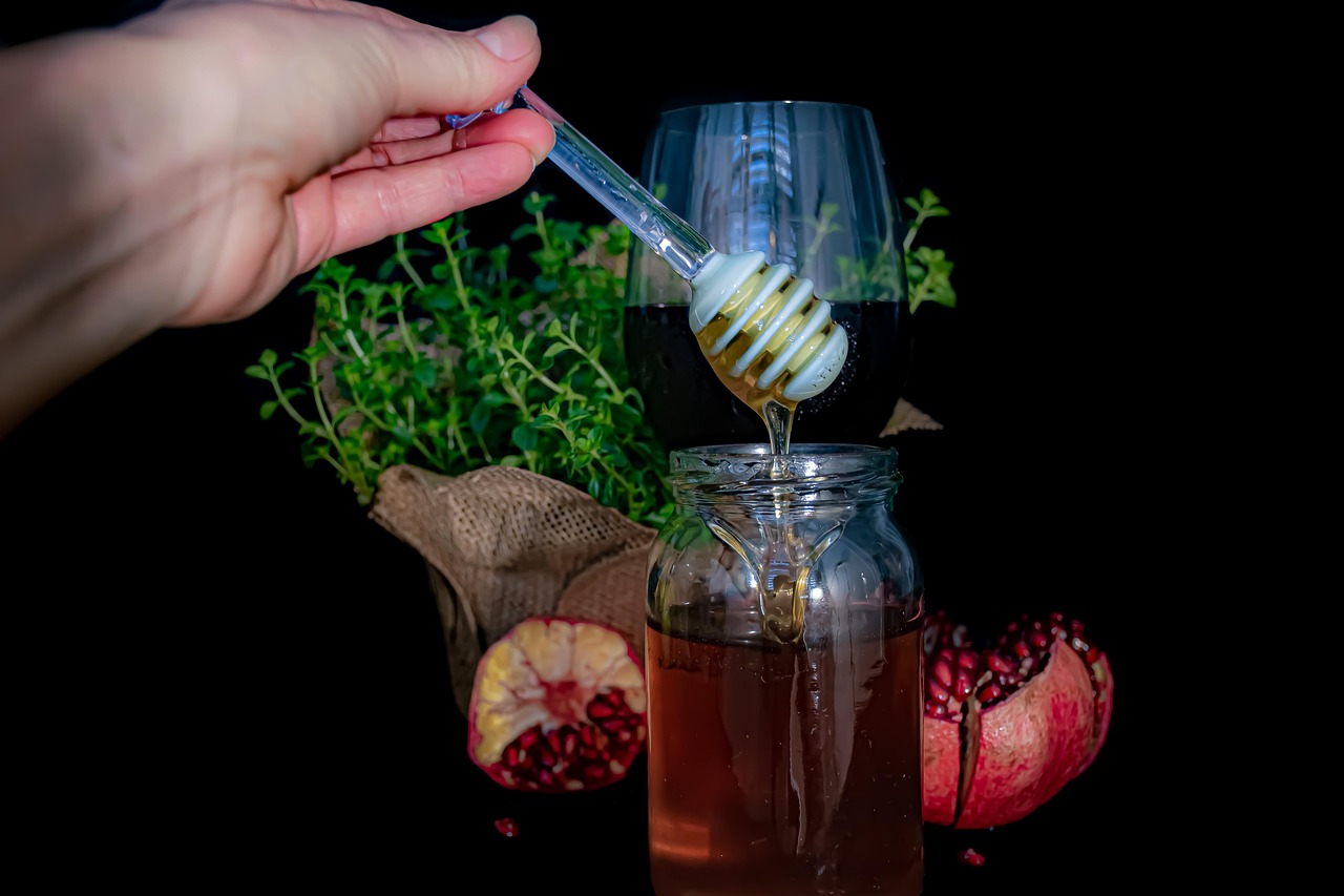 Assorted slices of dried oranges and apples stored neatly in glass mason jars