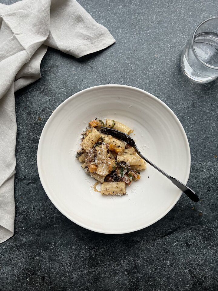 Rigatoni pasta combined with roasted butternut squash and bits of salty guanciale.