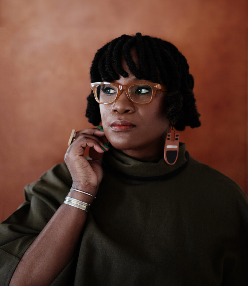 Portrait of Hadiya Williams wearing glasses and a slouchy shirt.