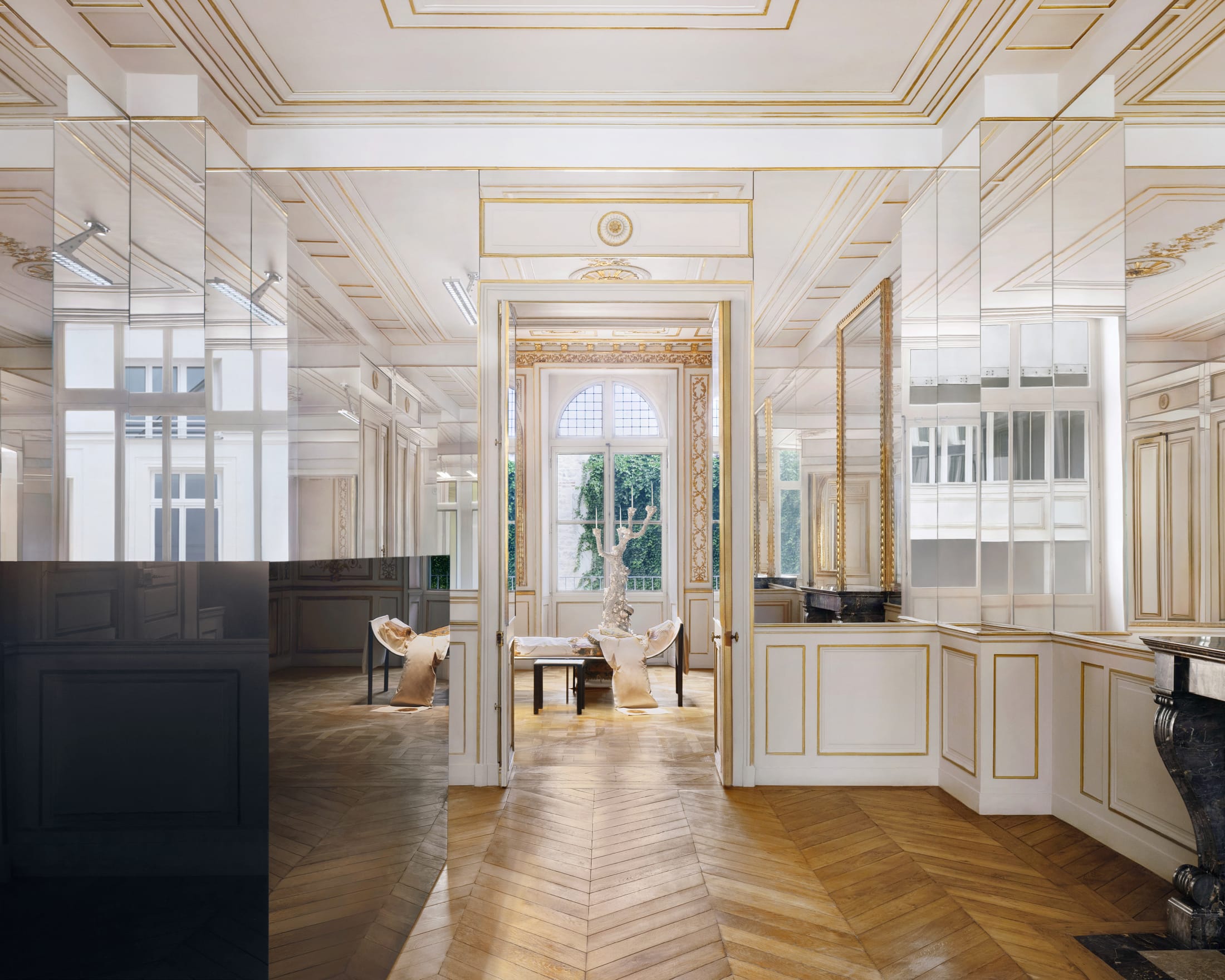 Benoît Lalloz lighting fixtures integrated into the glass-tiled ceiling of the Paris headquarters.