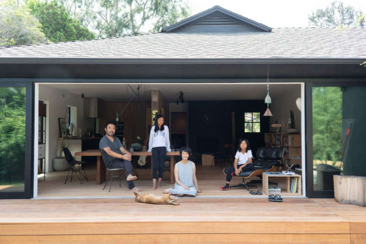 Large sliding glass doors that open the back of the house completely to the garden yard.